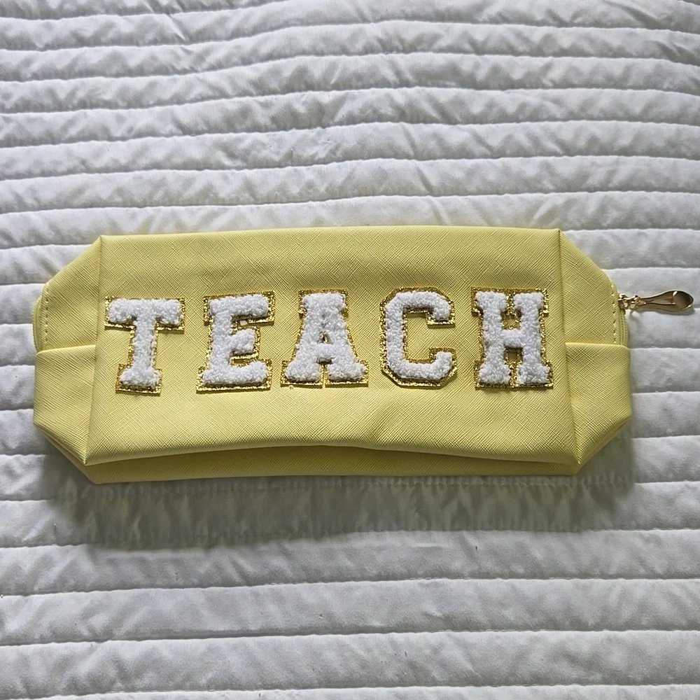 TEACH pouch with zipper chenille letters NWOT MATERIAL easy wipe off pale yellow